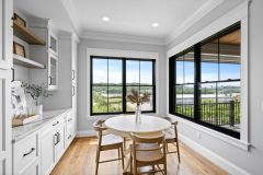 Kitchen Dining area with custom Built-ins at River Belle