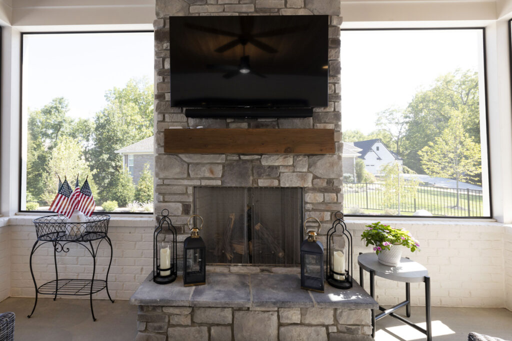 Covered Screen Porch with Stone Fireplace