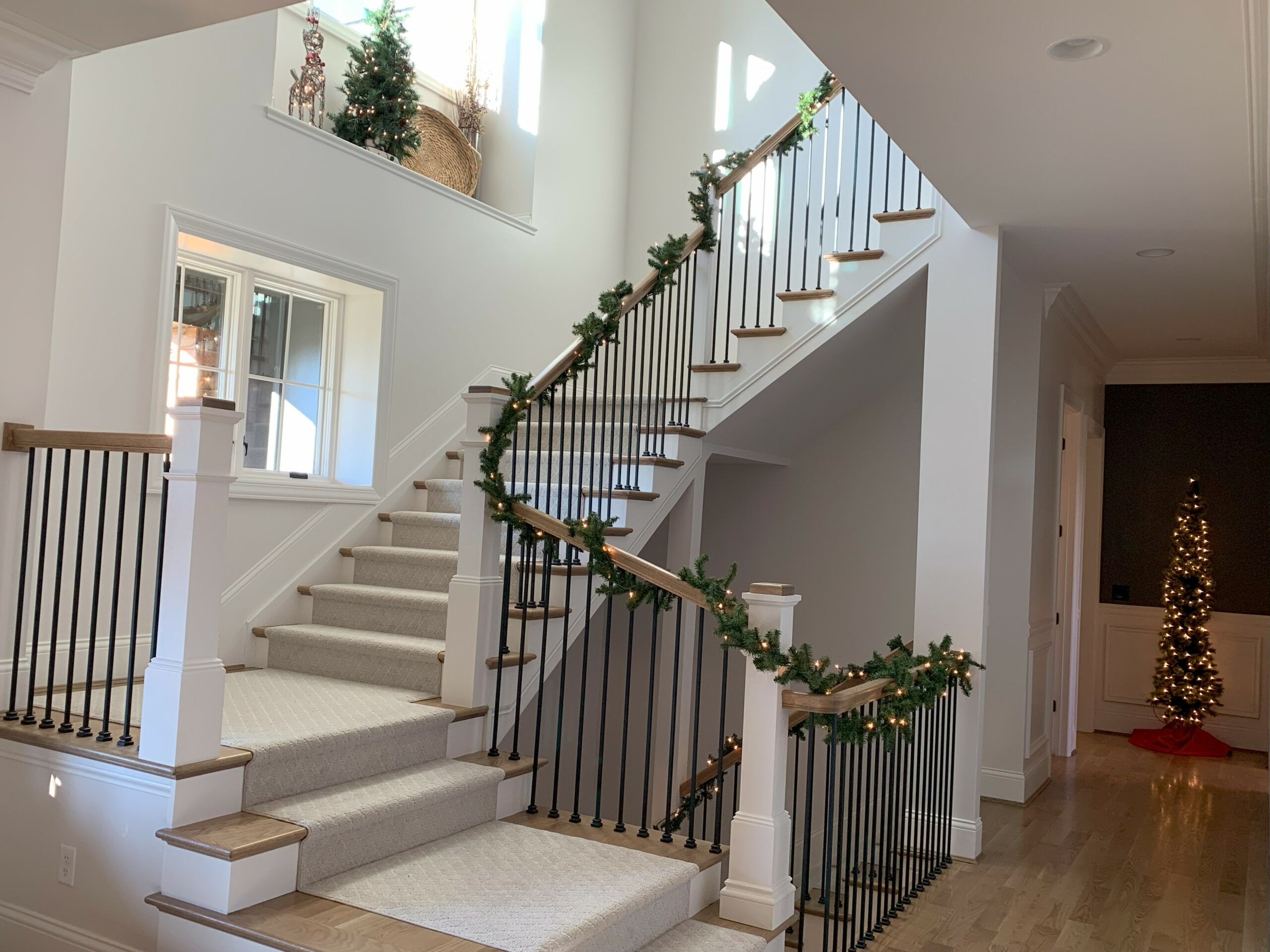 Staircase with Christmas decor at The Woodford